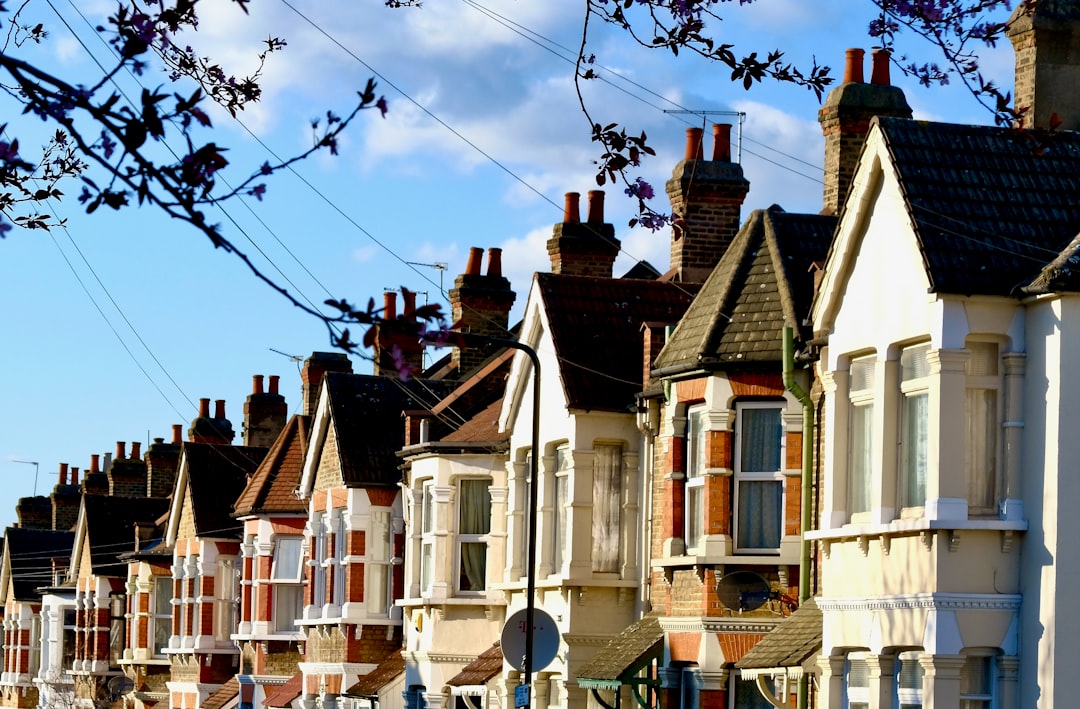 white and brown concrete houses under blue sky during daytime